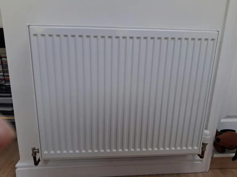 New radiator fitted in a small home extension in Hale